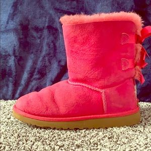 Pink UGG boots with bows